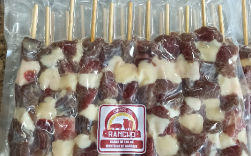 Espetinho de carne de sol na manteiga de garrafa